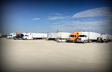 Trailers and trucks parked in the SDR shop yard