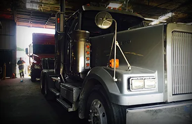 Semi truck parked inside the SDR repair bay